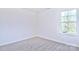 Simple bedroom with a window and neutral carpet at 201 Wedge View Way, Statesville, NC 28677