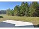 Spacious backyard with a patio and mature trees at 205 Wedge View Way, Statesville, NC 28677