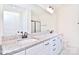 Bathroom with double sinks, granite countertop, and a shower at 103 Bunker Hill Ln, Statesville, NC 28677