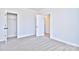 Bright bedroom with grey carpet and an open closet at 103 Bunker Hill Ln, Statesville, NC 28677
