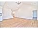 Spacious living room with vaulted ceiling and hardwood floors at 103 Bunker Hill Ln, Statesville, NC 28677