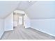 Open loft area with carpet and access to another room at 103 Bunker Hill Ln, Statesville, NC 28677