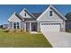 Ranch home with gray siding and a two-car garage at 103 Bunker Hill Ln, Statesville, NC 28677