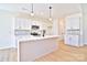 Modern kitchen with white cabinets and quartz countertops at 103 Bunker Hill Ln, Statesville, NC 28677