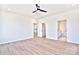 Bright bedroom with hardwood floors and ceiling fan at 103 Bunker Hill Ln, Statesville, NC 28677