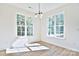 Bright breakfast nook with wood-look flooring and large windows at 103 Bunker Hill Ln, Statesville, NC 28677
