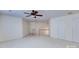 Large bedroom with ceiling fan, carpet, and double closets at 6416 Red Maple Dr, Charlotte, NC 28277