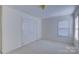 Spacious bedroom with neutral walls, carpeting, and double doors at 6416 Red Maple Dr, Charlotte, NC 28277