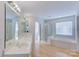 Bathroom with double vanity, large soaking tub, and walk-in shower at 6416 Red Maple Dr, Charlotte, NC 28277