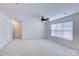 Spacious bedroom with ceiling fan, carpet, and double closets at 6416 Red Maple Dr, Charlotte, NC 28277