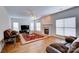 Living room with hardwood floors, fireplace, and comfortable leather furniture at 6416 Red Maple Dr, Charlotte, NC 28277