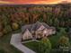 Aerial view of a luxurious two-story home situated on a tree-lined lot at 816 Pine Valley Ct, Weddington, NC 28104