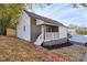 Newly renovated home with brick pathway and a wooden front porch at 944 15Th St, Lancaster, SC 29720