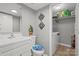 Bright bathroom with white vanity and in-unit laundry at 2009 Stoney Point Ln # 24, Charlotte, NC 28210