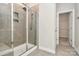Clean bathroom with a walk-in shower and access to a closet at 7403 American Elm Rd, Charlotte, NC 28215