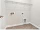 Laundry room with shelving and hookups for washer/dryer at 7403 American Elm Rd, Charlotte, NC 28215