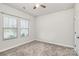 Cozy bedroom with neutral decor and two large windows at 7403 American Elm Rd, Charlotte, NC 28215