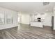 Open concept kitchen with island and hardwood floors at 7403 American Elm Rd, Charlotte, NC 28215