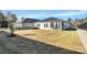 Spacious backyard with screened porch and grassy area at 7403 American Elm Rd, Charlotte, NC 28215
