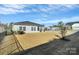 Large backyard with screened porch and grassy area at 7403 American Elm Rd, Charlotte, NC 28215
