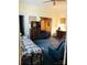 Spacious living room with patterned sofa and armchairs at 115 S Pearl St, Troy, NC 27371