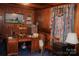 Spacious home office with large desk and wood-paneled walls at 115 S Pearl St, Troy, NC 27371
