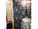 Bathroom with floral wallpaper, antique sink and toilet at 115 S Pearl St, Troy, NC 27371