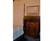Bedroom with fireplace, four poster bed, and antique artwork at 115 S Pearl St, Troy, NC 27371