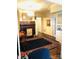 Classic dining room with hardwood floors and a wood-burning fireplace at 115 S Pearl St, Troy, NC 27371