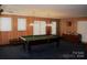 Fun game room with a pool table and plenty of natural light at 115 S Pearl St, Troy, NC 27371