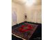 Bright bedroom with large windows and a decorative rug at 115 S Pearl St, Troy, NC 27371