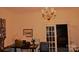 Living room features antique furniture and a vintage aesthetic at 115 S Pearl St, Troy, NC 27371
