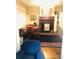 Charming dining room with hardwood floors and a wood-burning fireplace at 115 S Pearl St, Troy, NC 27371
