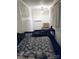 Serene bedroom with patterned bedding and a comfortable armchair at 115 S Pearl St, Troy, NC 27371