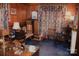 Home office with wood paneling, antique furniture, and rich color scheme at 115 S Pearl St, Troy, NC 27371
