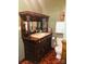 Bathroom with antique vanity, toilet and shower at 115 S Pearl St, Troy, NC 27371