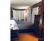 Cozy main bedroom with wooden accents and ample closet space at 115 S Pearl St, Troy, NC 27371