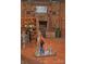 Rustic basement bar with stone fireplace and wine storage at 115 S Pearl St, Troy, NC 27371