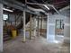 Partially finished basement area with exposed support beams and ductwork at 602 W Council St, Salisbury, NC 28144