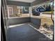 Spacious front porch with gray siding and wood flooring at 602 W Council St, Salisbury, NC 28144