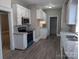 Kitchen with granite countertops, white cabinets, and stainless steel appliances at 602 W Council St, Salisbury, NC 28144