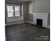 Living room with fireplace and built-in window seat at 602 W Council St, Salisbury, NC 28144