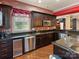 Basement kitchen with dark cabinets and stainless steel appliances at 816 Pine Valley Ct, Weddington, NC 28104