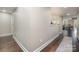 Basement hallway with dark hardwood floors leading to other rooms at 1988 Sapphire Meadow Dr, Fort Mill, SC 29715