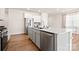 Kitchen island with white quartz countertop and stainless steel dishwasher at 125 White Apple Way, Statesville, NC 28625