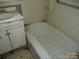 Bathroom with a vintage tub, sink, and medicine cabinet at 5150 Goodman Lake Rd, Salisbury, NC 28146