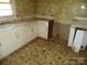 Kitchen with white cabinets and linoleum floor at 5150 Goodman Lake Rd, Salisbury, NC 28146