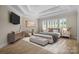 Spacious main bedroom with hardwood floors and a large window at 3460 Jennings Rd, Union Grove, NC 28689