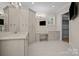 Bathroom with double vanity, large mirror, and custom cabinetry at 3460 Jennings Rd, Union Grove, NC 28689