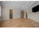Main bedroom with hardwood floors and access to bathroom and laundry at 3460 Jennings Rd, Union Grove, NC 28689